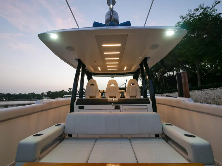 Low Hours Yacht Photos Pics 2020 Ocean Alexander 45 Divergence Sport boat interior at sunset, featuring modern seating and lighting.