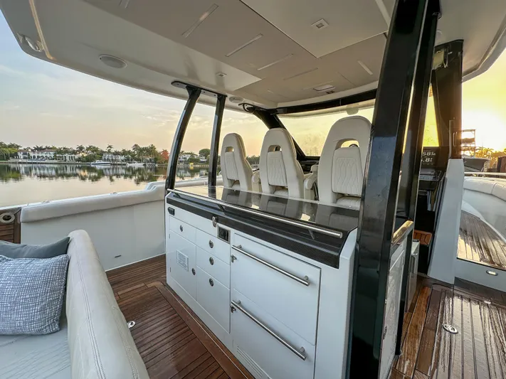 Low Hours Yacht Photos Pics 2020 Ocean Alexander 45 Divergence Sport yacht interior with luxurious seating and cabinetry.