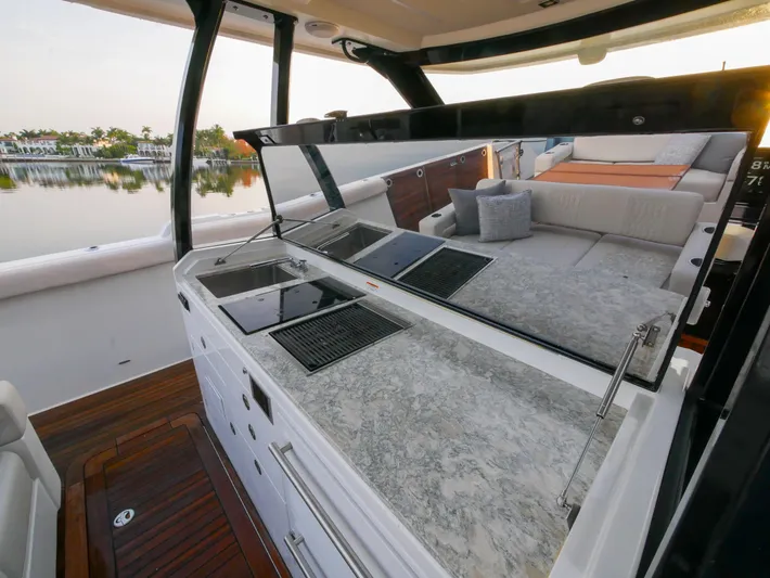 Low Hours Yacht Photos Pics 2020 Ocean Alexander 45 Divergence Sport yacht interior with sleek kitchen and seating area.