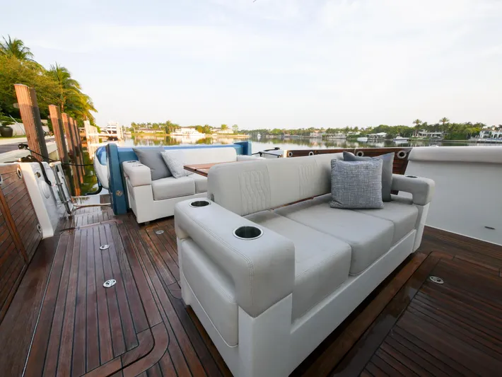 Low Hours Yacht Photos Pics Luxurious seating on 2020 Ocean Alexander 45 Divergence Sport yacht with scenic waterfront view.