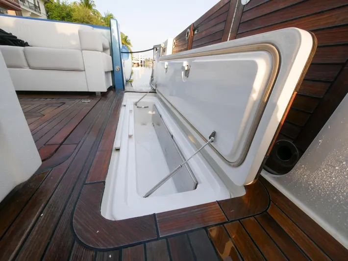 Low Hours Yacht Photos Pics 2020 Ocean Alexander 45 Divergence Sport yacht with open deck storage compartment.