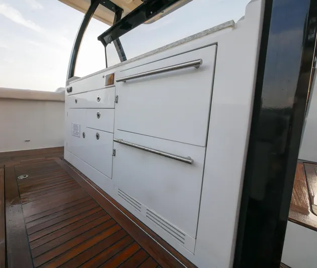 Low Hours Yacht Photos Pics 2020 Ocean Alexander 45 Divergence Sport yacht interior with sleek cabinetry and wooden flooring.