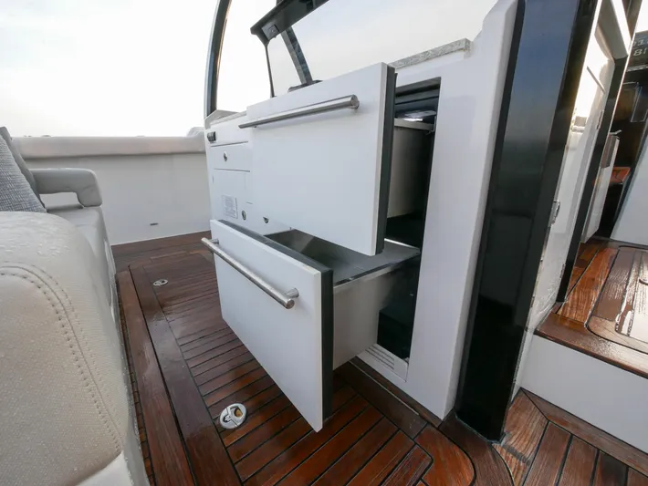 Low Hours Yacht Photos Pics 2020 Ocean Alexander 45 Divergence Sport yacht with open storage drawers on teak deck.