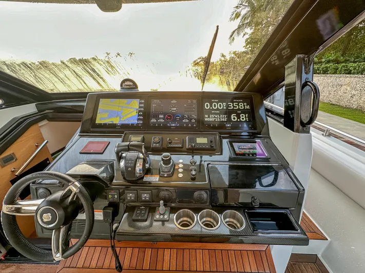 Low Hours Yacht Photos Pics Control panel of 2020 Ocean Alexander 45 Divergence Sport yacht with navigation displays.