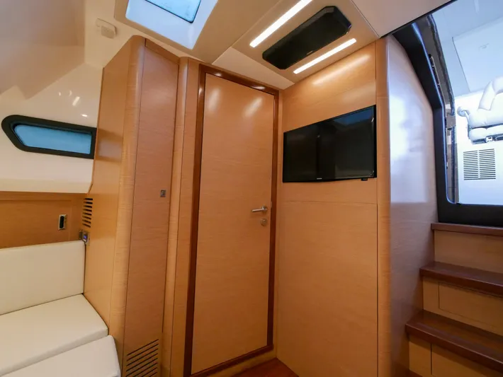 Low Hours Yacht Photos Pics Interior of 2020 Ocean Alexander 45 Divergence Sport, featuring modern wood paneling and seating.