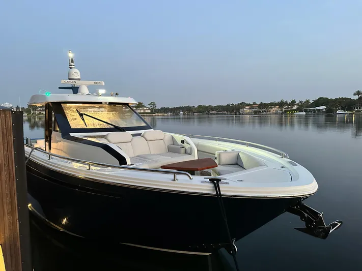 Low Hours Yacht Photos Pics 2020 Ocean Alexander 45 Divergence Sport yacht docked on calm water.