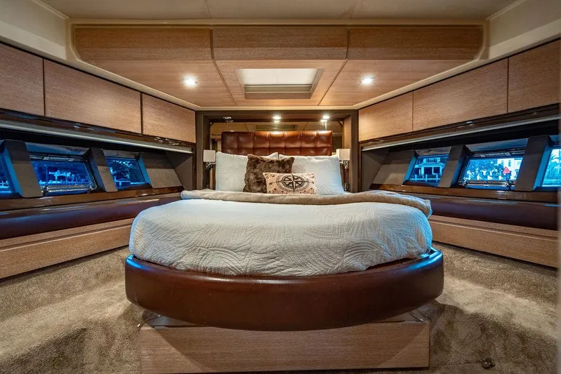 Vitamin Sea Yacht Photos Pics Luxurious bedroom interior of 2011 Azimut 70 Fly yacht with round bed and elegant decor.