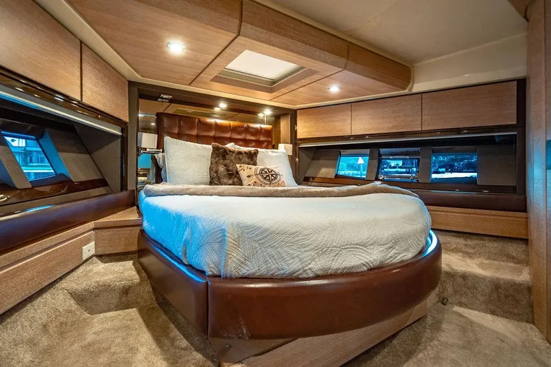 Vitamin Sea Yacht Photos Pics Luxurious bedroom interior of 2011 Azimut 70 Fly yacht with modern design and ambient lighting.
