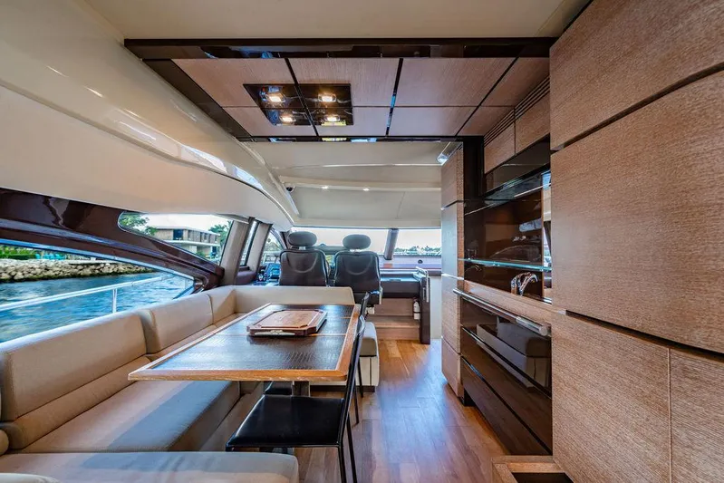 Vitamin Sea Yacht Photos Pics Luxurious interior of 2011 Azimut 70 Fly yacht with modern dining and kitchen area.