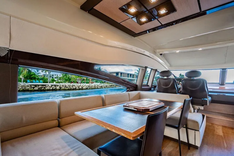 Vitamin Sea Yacht Photos Pics Luxurious interior of 2011 Azimut 70 Fly yacht with elegant seating and dining area.