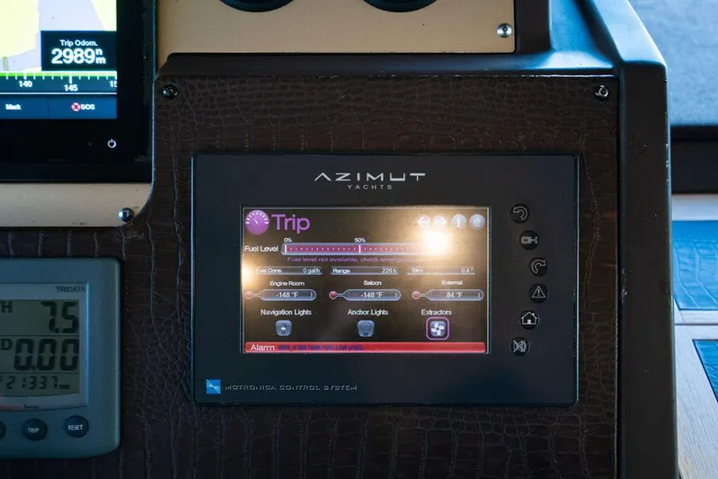 Vitamin Sea Yacht Photos Pics Control panel of 2011 Azimut 70 Fly yacht displaying trip information and settings.