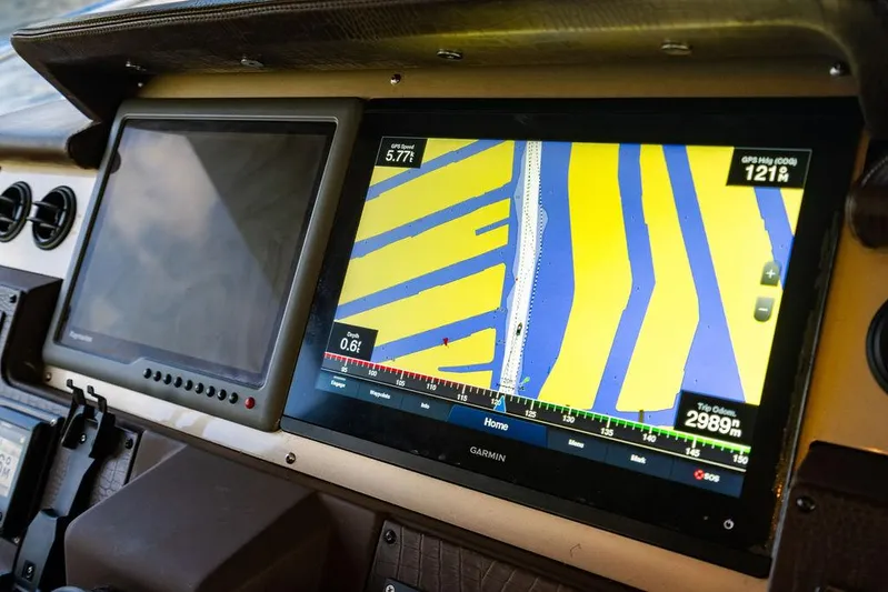 Vitamin Sea Yacht Photos Pics Control panel of a 2011 Azimut 70 Fly yacht with navigation display.