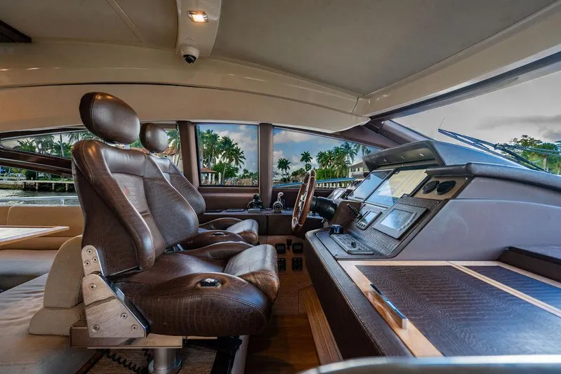 Vitamin Sea Yacht Photos Pics Interior of 2011 Azimut 70 Fly yacht with leather seats and modern dashboard.