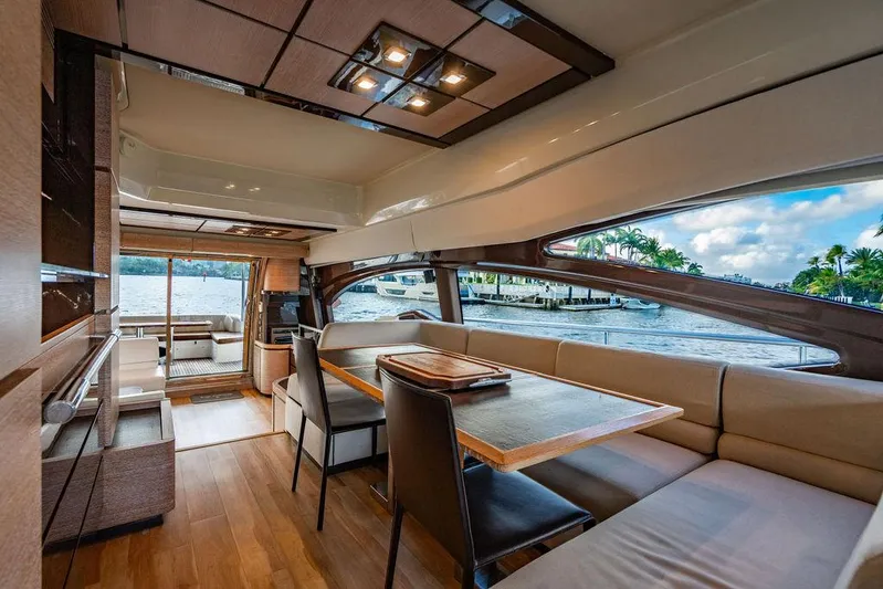 Vitamin Sea Yacht Photos Pics Luxurious interior of 2011 Azimut 70 Fly yacht with elegant seating and scenic water views.