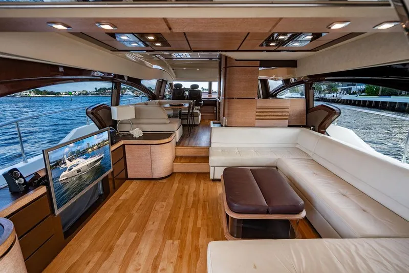 Vitamin Sea Yacht Photos Pics Luxurious interior of 2011 Azimut 70 Fly yacht with elegant seating and scenic water views.