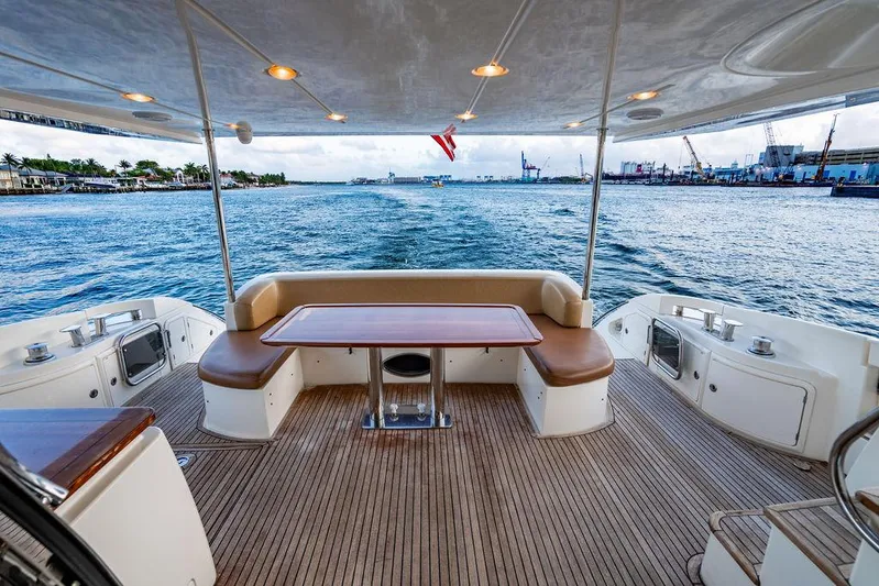 Vitamin Sea Yacht Photos Pics Luxurious 2011 Azimut 70 Fly yacht deck with seating, table, and ocean view.