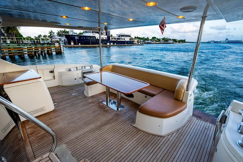 Vitamin Sea Yacht Photos Pics Luxurious 2011 Azimut 70 Fly yacht deck with seating, table, and ocean view.