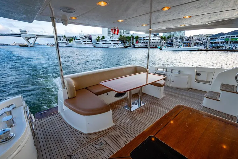 Vitamin Sea Yacht Photos Pics Luxurious 2011 Azimut 70 Fly yacht deck with seating, overlooking marina.
