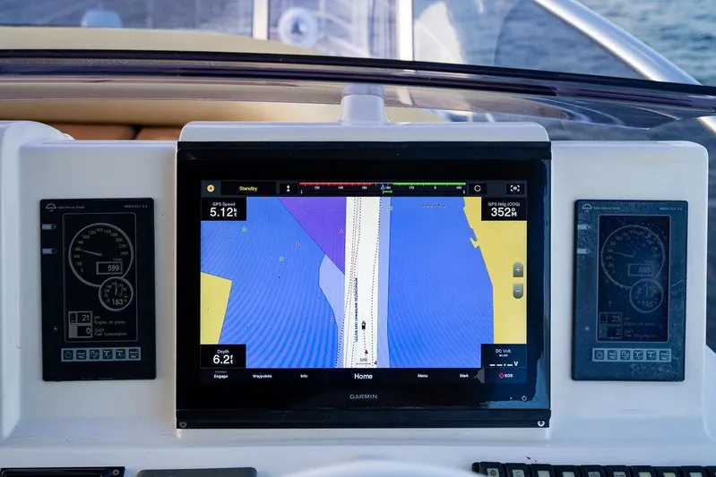 Vitamin Sea Yacht Photos Pics Navigation system on 2011 Azimut 70 Fly yacht dashboard, displaying nautical charts.