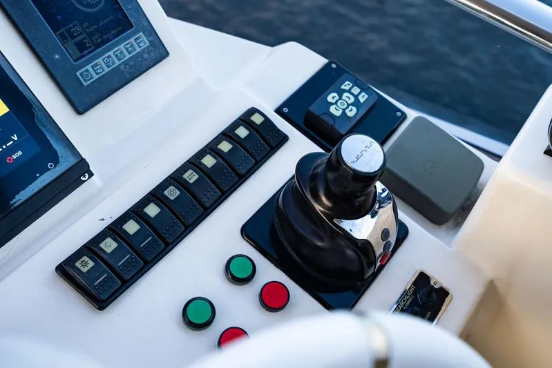 Vitamin Sea Yacht Photos Pics Control panel of a 2011 Azimut 70 Fly yacht with joystick and buttons.