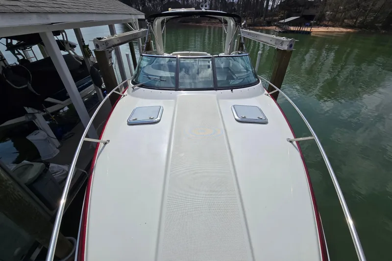  Yacht Photos Pics 2017 Formula 310 Sun Sport boat docked on calm water.