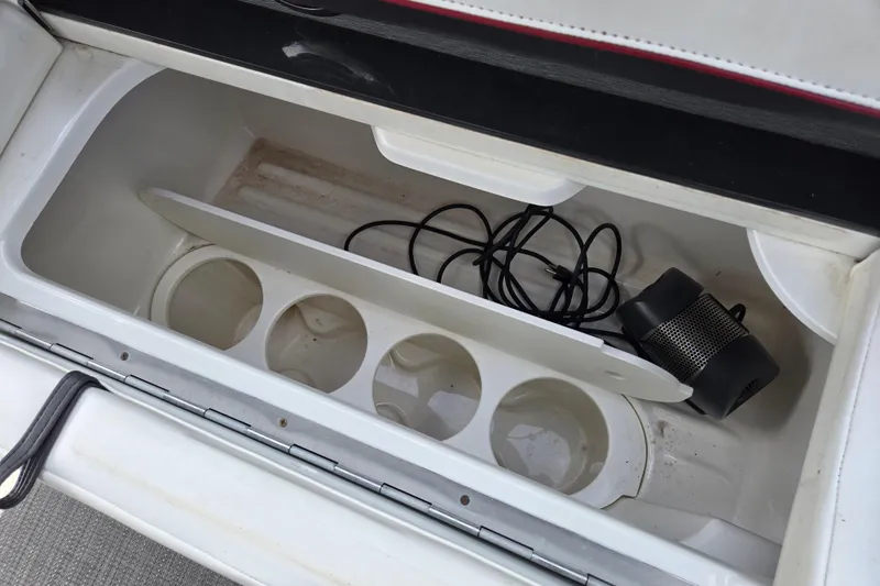  Yacht Photos Pics Storage compartment in 2017 Formula 310 Sun Sport boat with cup holders and speaker.