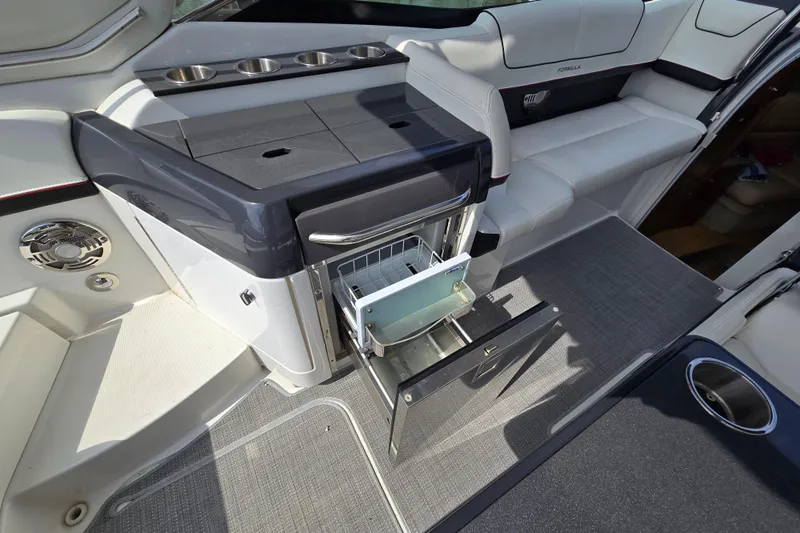  Yacht Photos Pics 2017 Formula 310 Sun Sport interior with open drawer and seating area.