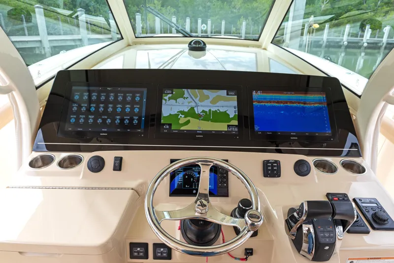  Yacht Photos Pics 2018 Scout 420 LXF boat dashboard with advanced navigation and control systems.