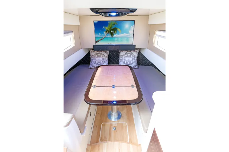  Yacht Photos Pics Luxurious interior of 2018 Scout 420 LXF boat with elegant seating and tropical decor.