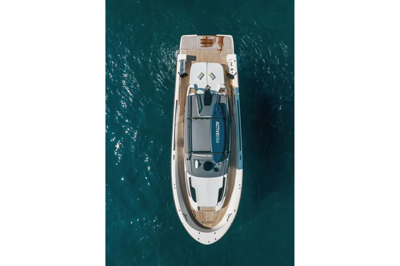  Yacht Photos Pics Overhead view of 2019 Bluegame BG42 yacht on clear blue water.