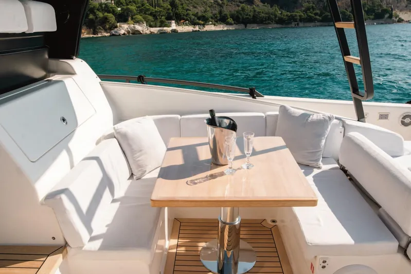  Yacht Photos Pics Luxurious 2019 Bluegame BG42 yacht interior with elegant seating and ocean view.