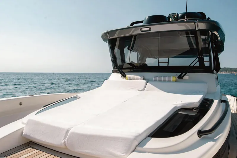  Yacht Photos Pics 2019 Bluegame BG42 yacht with sunbathing deck on calm sea.