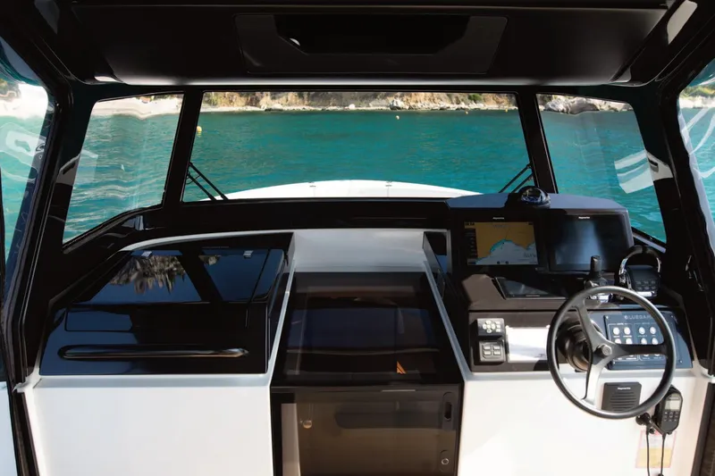  Yacht Photos Pics Interior view of 2019 Bluegame BG42 yacht cockpit with navigation equipment.