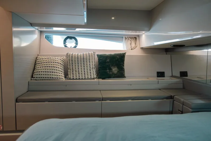  Yacht Photos Pics Interior of 2019 Bluegame BG42 yacht with modern seating and decorative pillows.