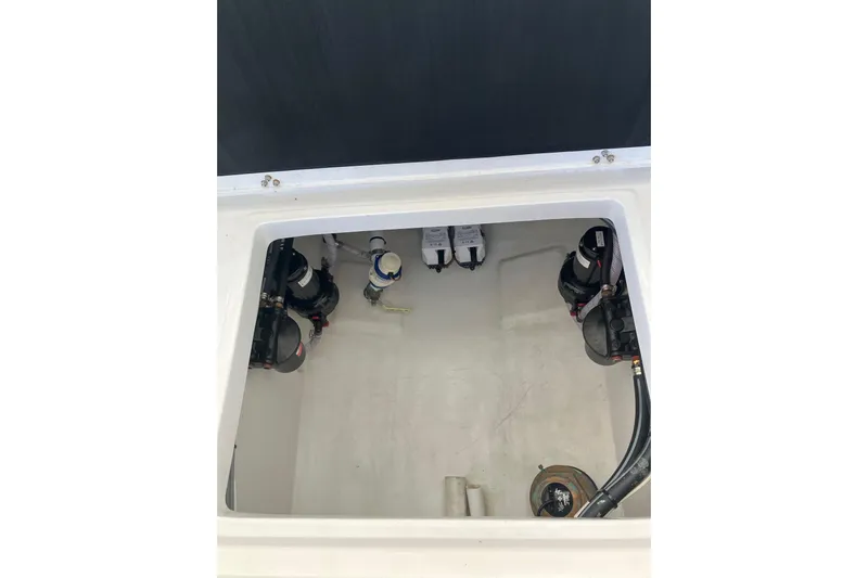  Yacht Photos Pics 2024 Latitude Tournament Boats 25 interior compartment with pumps and wiring.