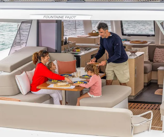Fp41 In San Diego. Yacht Photos Pics Family dining on Fountaine Pajot NEW 41 yacht, 2025 model, enjoying a meal together.