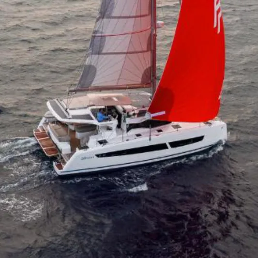 Fp41 In San Diego. Ex-factory Sept. 2025 Yacht Photos Pics 2025 Fountaine Pajot NEW 41 catamaran sailing at sunset with vibrant red sails.