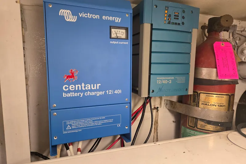 Lay A Wake Yacht Photos Pics Battery chargers and fire extinguisher in 1990 Viking 53 Convertible yacht engine room.