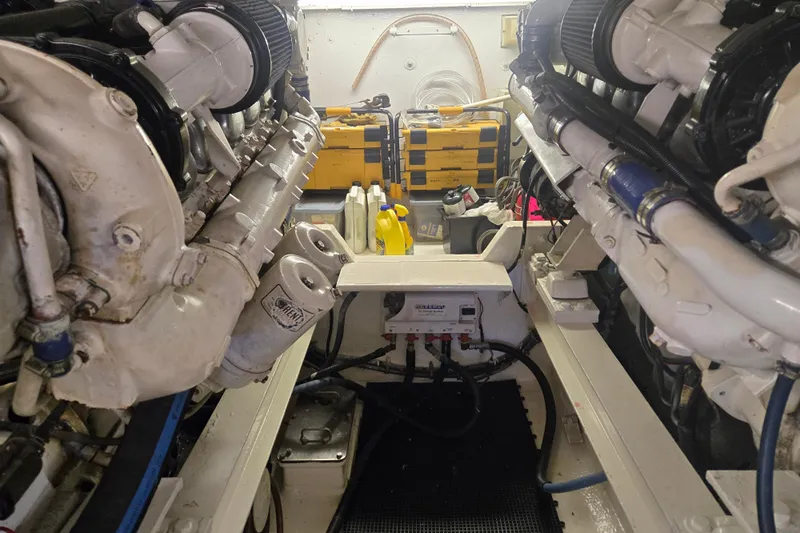 Lay A Wake Yacht Photos Pics Engine room of a 1990 Viking 53 Convertible yacht, showcasing dual engines and equipment.
