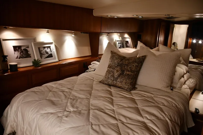 Lay A Wake Yacht Photos Pics Luxurious bedroom interior of a 1990 Viking 53 Convertible yacht with cozy bedding.