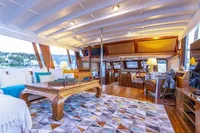 Luxurious interior of 1987 Aberdeen Marina Complex Chinese wood junk, featuring elegant furnishings and decor.