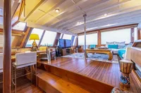 Luxurious interior of 1987 Aberdeen Marina Complex Chinese wood junk, featuring elegant wooden flooring.