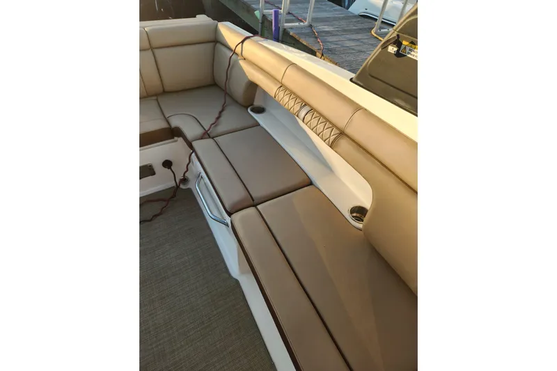  Yacht Photos Pics Luxurious seating on 2017 Sea Ray SDX 290 Outboard boat, featuring beige upholstery.