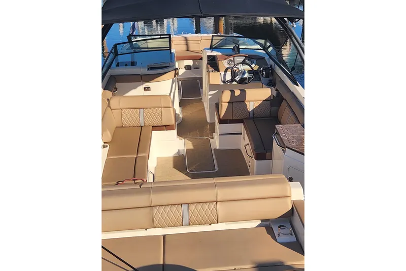  Yacht Photos Pics 2017 Sea Ray SDX 290 Outboard boat interior with tan seating and steering console.