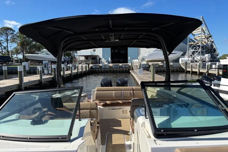  Yacht Photos Pics 2017 Sea Ray SDX 290 Outboard boat docked at marina under clear blue sky.