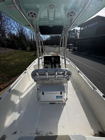 2025 Bulls Bay 2400 boat interior with console and seating, parked outdoors.