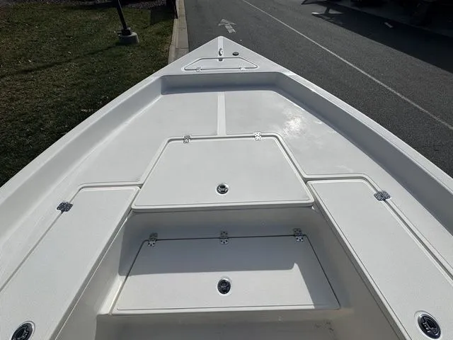 Bow view of 2025 Bulls Bay 2400 boat with storage compartments.