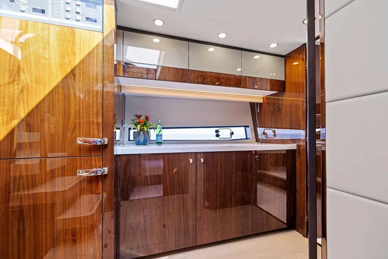Gt50/251 Yacht Photos Pics Luxurious kitchen interior of 2025 Fairline Targa 50 GT yacht with sleek wood finishes.