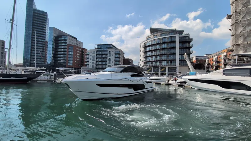 Gt50/251 Yacht Photos Pics 2025 Fairline Targa 50 GT yacht in a modern marina setting.