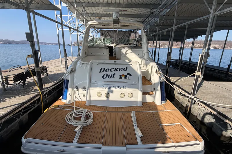  Yacht Photos Pics 2005 Formula 48 Yacht docked, rear view with "Decked Out" signage.